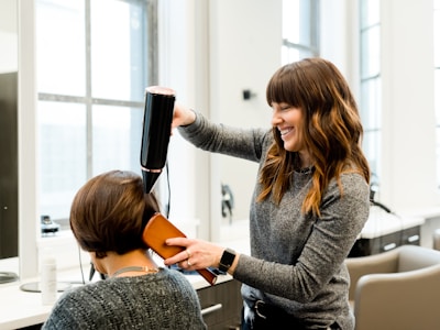 Woman getting olaplex treatment and blow dry
