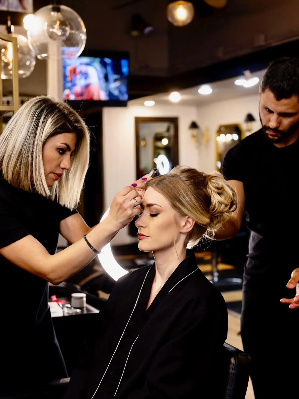 Woman receiving a haircut at Beauty Essence in Kirkland